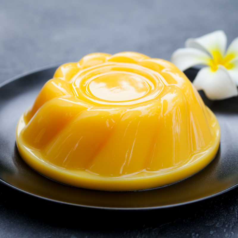 mango-pudding-jelly-dessert-on-black-plate-grey-2021-08-28-10-44-56-utc